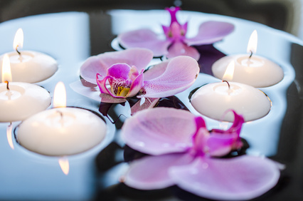 Floating candle and orchid flower