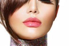 Hairstyle. Beauty Model Girl Portrait with Perfect Makeup